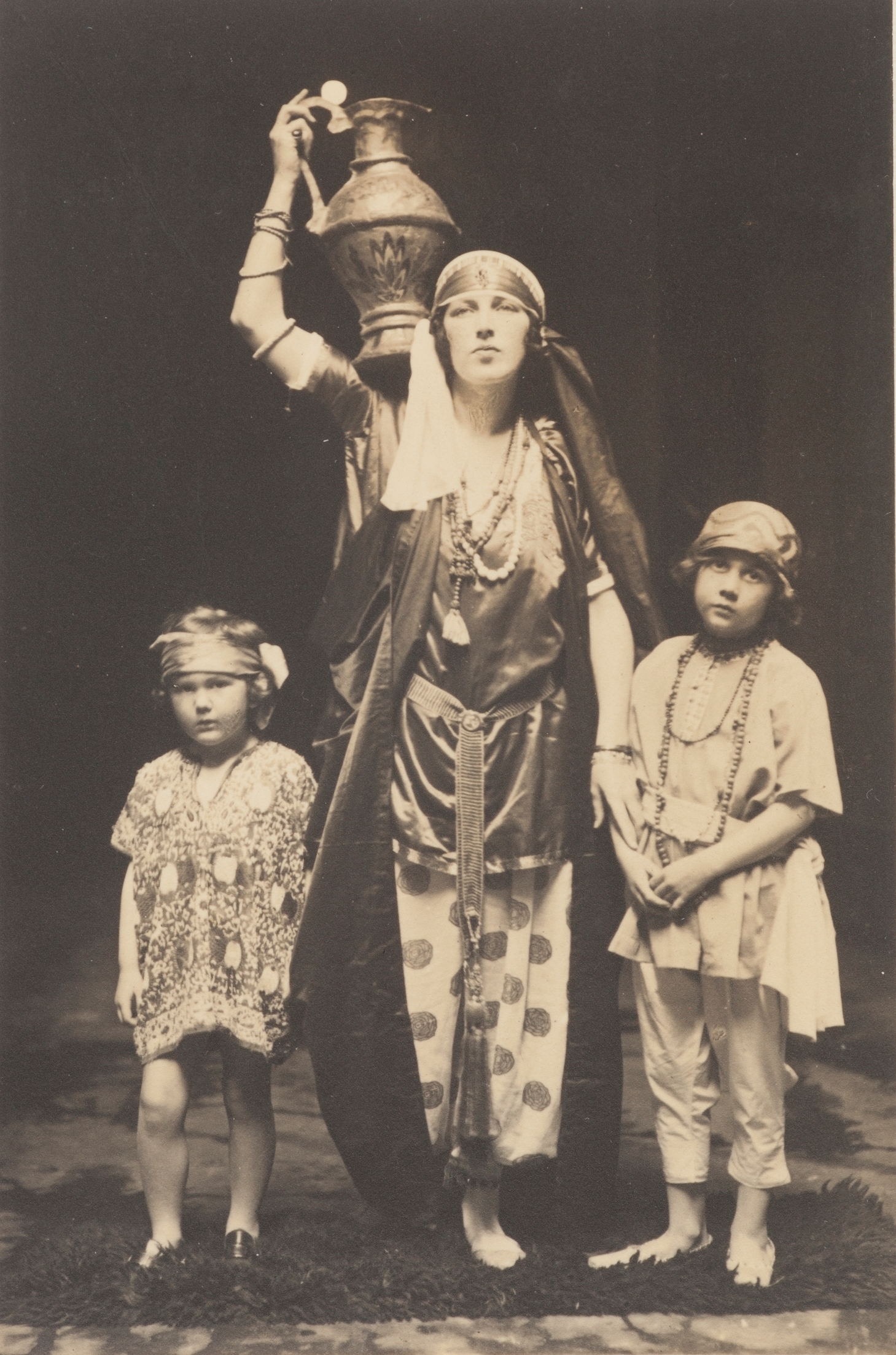 Mrs Leslie Walford as the wife of the Merchant Prince, with Anthony Hordern and Pauline McDonald in the matinee 'In a Persian Garden', held at the Theatre Royal, Sydney, 7 July 1922, in aid of the Royal Alexandra Hospital for Children / Harold Cazneaux
