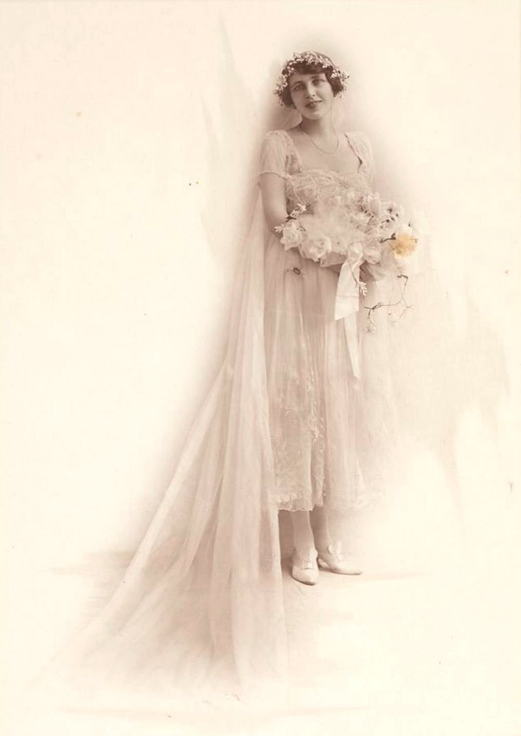 Studio portrait of Dora Alexander in her wedding dress, March 1917 / Falk Studios