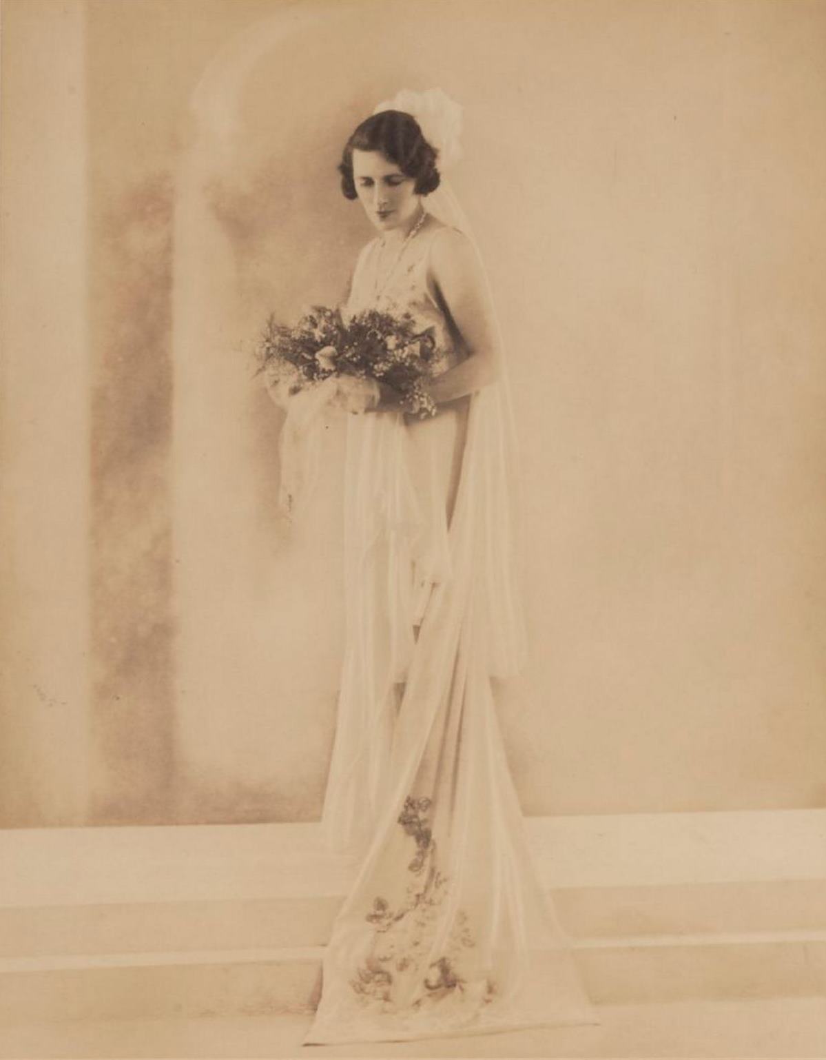 Studio portrait of Dora Sheller, previously Walford, in court dress, 1930 / Bassano