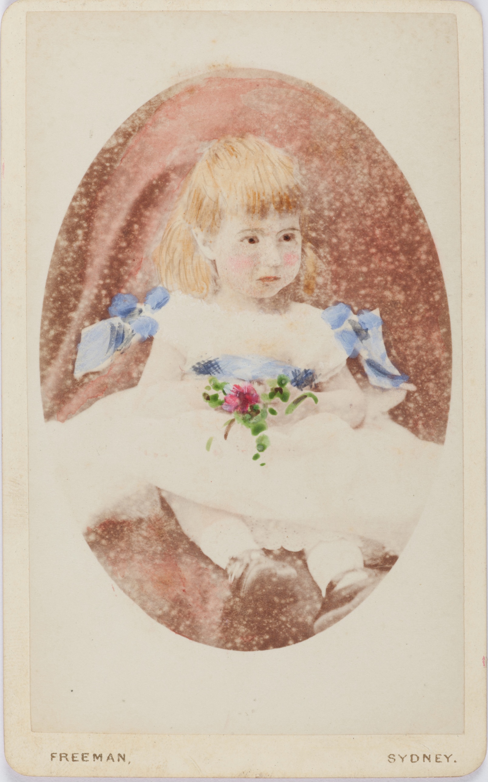 Hand coloured carte-de-visite photograph of Nina Beatrice Rouse as a young child, around 1876 / Freeman